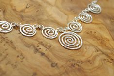 "✧Spiral necklace in Sterling silver designed and made by BIOS jewelry ✧ ◆ This classy silver necklace features a classic Spiral design and has been treated with care and presision in our workshop in Greece ◆ It radiates its high quality craftsmanship made completely by hand using sterling silver wire ◆ It features the Spiral motif, one of the oldest and most popular symbols worldwide. A symbol that appears frequently in nature and in ancient civilizations from the ancient Celts to Greeks and Na Sterling Silver Swirl Necklaces, Handmade Spiral Silver Necklace, Handmade Silver Spiral Necklace, Ancient Celts, Spiral Necklace, Spiral Ring, Celtic Style, Greek Jewelry, Spiral Design