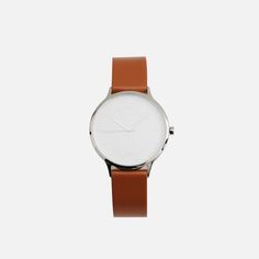 ULX Store Minimalist Brown Business Watches, Brown Minimalist Watch For Business, Brown Minimalist Watches For Business, Modern Brown Watch Accessories For Work, Modern Brown Watch Accessories For Workwear, Minimalist Leather Watch, Minimalist Quartz Business Watch, Silver Office Watch With Round Dial, Minimalist Quartz Watches For Business