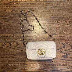 Gucci Marmont Leather Super Mini Bag In White. This Bag Is Brand New Never Used, So It Is In Perfect Condition. I Added The Dimensions Of The Bag In The Pictures. It Is On The Smaller Side - It Just Fits My Iphone 11 Pro Max. It Can Fit A Couple Of Cards/Cash As Well. White Gucci Shoulder Bag For Evening, White Designer Gucci Bags, White Gucci Bag For Formal Occasions, Designer White Gucci Shoulder Bag, White Gucci Shoulder Bag With Chain Strap, Gucci Cross Body Bag, Gucci Camera Bag, Gucci Vintage Bag, Red Crossbody Bag