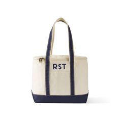 a white and blue tote bag with the word rst on it's side