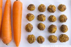 carrots and cookies are on a white tray