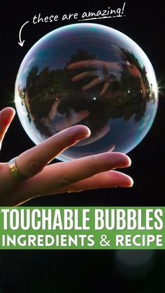 A woman's hand holding an unbreakable bubble, showing that it's touchable. No Pop Bubbles Recipe, Magic Bubble Glue, Large Bubbles Diy, Glycerin Bubble Recipe, Magic Unpoppable Bubbles, Indoor Bubble Activities, Bubbles That Dont Pop Recipe, How To Make Homemade Bubbles, Super Bubbles Recipe Homemade