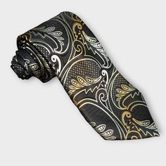 Treat yourself with a new pattern and splash of color to your look with this unique tie set. 100% Silk Handmade Package Includes: Tie, Pocket Square & Cufflinks. Length: 59" Width: 3.34" Warm iron if needed Luxury Semi-formal Ties With Pocket Square, Luxury Elegant Paisley Print Ties, Luxury Classic Patterned Ties, Patterned Luxury Ties For Semi-formal Occasions, Luxury Patterned Silk Tie, Unique Ties, Cufflink Set, Tie Set, Tie And Pocket Square