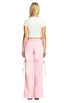 Details Best-selling Naima Cargo Pant is back Baby pink denim jean - Cargo pant style Low-rise waist and relaxed silhouette Double studded belt with silver buckle and eyelets Workable pockets throughout the front and back Featuring workable drawstring at thigh Unlined - This fabric is not sheer Recommended Underwear: Due to the low-mid rise, we recommend wearing this garment with a seamless low-mid brief Size and Fit True to size. We recommend wearing your standard size Low-rise waist - Sits app High-waist Cargo Jeans With Belt Loops For Spring, Pink Wide Leg Cargo Jeans For Summer, Trendy Pink Summer Cargo Jeans, Pink Cotton Cargo Jeans For Summer, Pink Straight Leg Cargo Pants For Spring, Summer Pink Cotton Cargo Jeans, Pink Cotton Cargo Jeans For Spring, Pink Mid-rise Cargo Pants For Spring, Pink Wide Leg Cargo Jeans