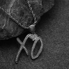 Introducing our exclusive Weeknd XO Necklace, a stunning homage to the musical genius of Abel Tesfaye. Crafted with precision from stainless steel and adorned with white enamel, this pendant is a symbol of The Weeknd's XO movement and his iconic albums, including Trilogy, Kissland, and Starboy. Embrace the enigmatic allure of The Weeknd's music with this exquisite pendant necklace. The XO symbol represents passion, loyalty, and the unwavering commitment of fans worldwide to Tesfaye's transformat Xo Jacket The Weeknd, Xo Symbol, Xo Jacket, Xo Necklace, Xo Jewelry, Abel Tesfaye, Swaggy Outfits, Day Wishes, The Weeknd