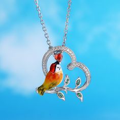 Designed for the free-spirited, the kingfisher is symbolic of freedom, courage, adventure, and balance. Each piece has been delicately hand-painted, displaying the uniqueness of its bright yellow feathers and orange plumage against a silver base. It is a true gift to spot one of these elusive creatures in nature.Carat Weight: 0.341 ctStone Size: 1,3*3,0.8 mmStone Type: Jeulia® StoneNumber of Stones: 44 Stone Shape: Round, HeartStone Color: Diamond White, Garnet RedChain Type: Cable chainWeight: Bird-shaped Bird-design Necklace For Gifts, Bird Design Necklace Perfect For Gifts, Bird Design Necklace As A Gift, Bird Design Necklace For Gift, Nature-inspired Multicolor Jewelry Gift, Whimsical Artistic Jewelry For Gifts, Whimsical Artistic Design Jewelry Gift, Whimsical Artistic Design Jewelry For Gift, Nature-inspired Artistic Jewelry For Gifts