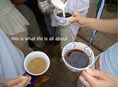 three people are holding coffee cups with the words, this is what life is all about