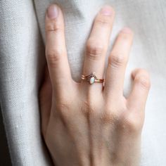 -Simple oval ring stacked with milgrain crown chevron. -14k Solid rose gold fully hallmarked. -Total diamond weight: 0.02ct-Diamond: 1.75mm-Clarity: SI1-Color: G+-Cut: Brilliant -1.4mm band width. -3x5mm Genuine Australian opal-1.75mm round diamond All of our jewelry will arrive in custom packaging ready for gift giving. LEAD TIME:Made to order will take 10-14 days. Minimalist Oval Diamond Stackable Rings, Oval Stackable Rings With Single Diamond, Delicate Oval Diamond Ring With Accents, Delicate Oval Diamond Ring With Single Stone, Delicate Oval Diamond Ring With Single Diamond, Oval Stackable Wedding Rings With Single Diamond, Oval Dainty Birthstone Ring With Rose Cut Diamonds, Delicate Oval Ring With Single Diamond, 14k Gold Oval Diamond Stackable Ring