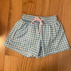 Nwt And Never Worn. Blue Gingham Swim Shorts. Mesh Lining And Drawstring Closure. Cute Blue Shorts For Playwear, Cute Blue Summer Pajama Shorts, Cute Blue Shorts For Playtime, Blue Summer Bottoms For Playtime, Summer Blue Bottoms For Playtime, Playful Blue Cotton Pajama Shorts, Cute Blue Shorts With Elastic Waistband, Light Blue Casual Bottoms For Playtime, Casual Light Blue Bottoms For Playtime