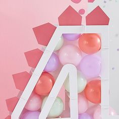 the number four is surrounded by balloons in front of a pink background with confetti