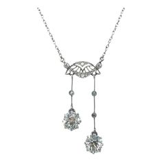 This beautiful Belle Époque négligée necklace enchants with its delicate and elegant playfulness. Two old European cut diamonds of J/K colour and vs clarity with a total weight of approximately 2.10 carats swing from a finely pierced central section on two delicate knife wire extensions. Three small hinges, set with rose-cut diamonds add further movement to the larger diamonds. Exceptionally high quality and fine craftsmanship from a glamorous era, which is still able to mesmerise today. A necklace like no other to fall in love with! Length: approx. 47.0 cm / 18.5 in Weight: 5.30 gr Small Hinges, European Cut Diamonds, Belle Epoque, Rose Cut Diamond, Rose Cut, Hinges, Jewelry Necklace Pendant, Diamond Necklace, Diamond Cuts