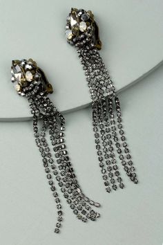 Classic details with a rockstar edge, the Axia Clip-On Statement Earrings feature large petal tassels and amazing beaded adornments. Materials: Crystal Size: 4" x 0.5" Clip-On Backing Classy Earrings, Outfit Shop, Boutique Homes, Boutique Accessories, Gift Boutique, Lifestyle Fashion, Unique Necklaces, Online Jewelry, Baby Accessories