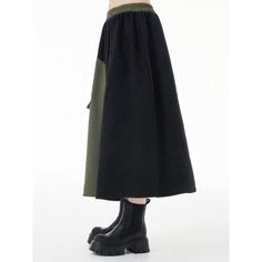 Discover Your New Favorite Skirt Step into the world of casual elegance with our Green & Black Asymmetric A-Line Skirt, a perfect blend of style and comfort for any season. Whether you're strolling through a spring garden or enjoying an autumn evening, this skirt's versatile design makes it an essential addition to your wardrobe. Product Features Size: One Size fits most, with a comfortable stretch from 26.8" to 44.9" at the waist. Length: Graceful mid-calf length at approximately 32.3 inches. Material: A harmonious blend of cotton and polyester, ensuring both comfort and durability. Style: A striking patchwork design in green and black, crafted in a flattering A-line silhouette. Season: Ideal for any season, this skirt pairs well with both summer tops and winter layers. Why Choose Our Asy Baggy Spring Midi Skirt, Chic Spring Midi Cargo Skirt, Spring Chic Midi Cargo Skirt, Chic Midi Cargo Skirt For Spring, Trendy Black Skirt With Patchwork, Casual Patchwork Skirt For Fall, Trendy Cotton Skirt With Asymmetrical Hem, Versatile Black Skirt For Fall, Trendy Long Skirt For Winter