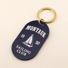 Distinguish your keys with our Montauk Sailing Club Pill Keychain. This handcrafted key fob was designed for those who love the aesthetics of a vintage club and would rather spend all their free time at the coast. Aesthetic Keychain, Keychain Aesthetic, Augusta Golf, French Guiana, Resort Collection, Pet Tags, Equatorial Guinea, Free Time, Mauritius