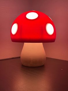 a mushroom shaped light sitting on top of a table