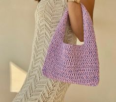 Crochet lilac small shoulder bag Trending now crochet bag a piece that will accompany you from special occasions to your daily life. The cute lilac bag provides both a youthful and dynamic look. Always carry the energy of spring and summer with you! The crochet tote bag has enough space for your daily items such as phone, headphones, wallet and makeup. It will always make a difference with its elegance and originality while accompanying you in your daily use or as a weekend bag. If you are looki Trendy Rectangular Crochet Bag As Gift, Trendy Rectangular Crochet Bag For Gift, Trendy Rectangular Crochet Bag, Cute Everyday Crochet Rectangular Bag, Trendy Handmade Crochet Shoulder Bag, Trendy Crochet Bag For Daily Use, Trendy Handmade Shoulder Bag For Everyday, Cute Everyday Crochet Tote Bag, Trendy Crochet Bag For Spring