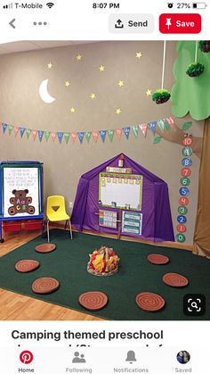 a classroom with lots of toys and decorations on the walls, including a tent for children to play in