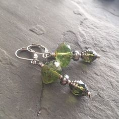 Peridot Czech  Two types of peridot Czech glass.  They're beautiful  Simply paired with silver Czech glass.  Leverback.   Earrings are 2 inches in length.  Lightweight. Earwires can be switched out to handmade earwires or sterling.  Please specify upon purchase.   Thank you for looking! 😊 Peridot Earrings, Peridot Green, Leverback Earrings, Green Earrings, Creative Jewelry, Glass Earrings, Czech Glass, Etsy Earrings, Dangle Drop Earrings