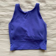 Tried On And Gently Washed Once; Never Worn For Exercise. Practically New Condition. Color: Charged Indigo Size : 2 Functional Purple Racerback Activewear, Purple Activewear With Built-in Bra For Light Exercise, Purple Sleeveless Activewear For Training, Purple Sleeveless Sports Bra For Yoga, Blue Compressive Tops For Light Exercise, Blue Racerback Tops For Pilates, Breathable Purple Tops For Sports, Purple Athleisure Sports Bra, Purple Athleisure Sports Bra With Built-in Bra