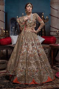 Heavy Raw Silk Ivory Lehenga Choli Bridal Dress is an embellished dress to wear on your big day. This dress is all embellished with zardozi, tila, Mukesh, zari, and Swarovski. When paired with a heavy lehenga and dupatta, this bridal dress is all set to make a lasting impact in its divine royalty. Choli: Our opulent and dreamy bridal couture is a tale of grandeur redefining elegance with intricate hand embellishments and 3d leaves with cutdana and pearl infusion. A tulle base raw silk choli come Dulhan Lehenga, Ivory Lehenga, 3d Leaves, Best Indian Wedding Dresses, Heavy Lehenga, Designer Bridal Lehenga Choli, Asian Bridal Dresses, Bridal Lehenga Collection, Latest Bridal Dresses