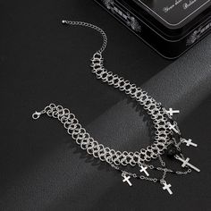 Description:Punk Layered Cross Tassel Collar Choker NecklaceSpecification:Size: 11.8" + 2.7" extWeight: 1.07 oz/pcsMaterial: alloy metal. glass seed beadChain colors: silverFeatures & Details:This punk style cross tassel collar choker necklace is made of nickel-free. lead-free. cadmium-free and hypoallergenic materials. which will not turn your skin green or cause anaphylactic reaction.It is easy to match your different outfits and also suitable for any occasions like wedding. banquet. costume p Punk Metal Choker For Halloween, Punk Style Metal Cross Jewelry, Punk Alloy Jewelry For Halloween, Silver Metal Choker With Beaded Chain, Halloween Metal Necklace With Adjustable Chain, Punk Style Dangle Metal Jewelry, Silver Beaded Alloy Necklaces, Punk Style Stainless Steel Jewelry For Party, Adjustable Silver Alloy Choker