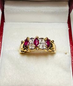 Absolutely Stunning Vintage 14k Yellow Gold Natural Ruby Diamond Ring 100% Natural Ruby and Diamonds Beautiful genuine Ruby Ruby: 0.50CT Diamond(s) .10CT Color: G Clarity: SI2 Total ring weight: 3.5GR 14K Yellow Gold Ring sizing available Free of Charge For more information regarding this item feel free to reach me so I can accommodate your needs. Thank you Classic Marquise Ruby Ring With Vvs Clarity, Formal Ruby Ring With Diamond Accents In Cluster Shape, Formal Cluster Ruby Ring With Diamond Accents, Elegant Marquise Ruby Ring With Vvs Clarity, Classic Marquise Ruby Ring With Brilliant Cut, Classic Ruby Cluster Ring Hallmarked, Classic Hallmarked Ruby Cluster Ring, Classic Ruby Ring With Diamond Accents In Cluster Shape, Classic Ruby Ring With Diamond Accents Cluster