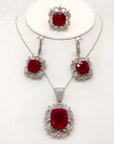 "Gorgeous and stunning set of ring, earrings, pendant and linked chain 18k solid white gold,diamond and cushion cut rubies. Total weight : 43.4 grams Total ruby weight appx : 51.31 TCW, lab created. Total diamond weight: 4.05 TCW Diamond clarity: VS1-2 (loupe clean) Diamond color: F (colorless) Pendant size appx : 40*25 mm, with the bail Earrings size appx : 40×20 mm ( longest to widest point ) Type of earrings fastening : Lever back Ring width on the top: 25 mm Chain length: 18\" Chain thicknes Exquisite White Gold Sterling Silver Jewelry Sets, Luxury White Gold Sterling Silver Jewelry Sets, Luxury Lab-created Ruby Jewelry For Wedding, Luxury Ruby Jewelry With Polished Finish, Luxury Jewelry With Prong Setting And Lab-created Ruby, Luxury Polished Ruby Jewelry, Luxury Jewelry With Diamond Accents And Lab-created Ruby, Exquisite Platinum Jewelry With Polished Finish, Red Cushion Cut Diamond Jewelry