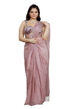 Dusky rose pre-draped skirt saree with a detachable pallu and beaded hand embroidery. Comes with a padded corset blouse. - Aza Fashions Fitted Organza Blouse Piece With Traditional Drape, Fitted Organza Pre-draped Saree, Organza Pre-draped Saree For Reception, Fitted Draped Lehenga For Party Wear, Draped Fitted Organza Saree, Elegant Pre-draped Saree With Dori Work, Elegant Sets With Dori Work For Evening, Fitted Draped Choli For Party Wear, Elegant Semi-stitched Sleeveless Pre-draped Saree