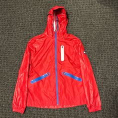 Never Worn Tommy Hilfiger Wind Breaker Size Large Casual Tommy Hilfiger Outerwear With Pockets, Casual Red Outerwear, Tommy Hilfiger Casual Hooded Windbreaker, Casual Hooded Tommy Hilfiger Windbreaker, Tommy Hilfiger Casual Spring Outerwear, Casual Tommy Hilfiger Outerwear For Spring, Casual Red Outerwear For Outdoor, Red Tommy Hilfiger Long Sleeve Outerwear, Tommy Hilfiger Spring Outdoor Outerwear