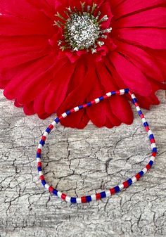 Very pretty tila bracelet in Patriotic Red White Blue. The tila beads are by Miyuki  and are glass. The tila beads are 5mm wide and 5mm long, small tile beads.  Stretch bracelet easy on easy off. The Tilas lay flat on your wrist and the bracelet is very lightweight.  It's a great bracelet by itself or stacked with others. Bracelet for 4th of July Memorial Day etc.  These beautiful, stretchy bracelets/anklet made from Japanese Miyuki Tila Beads. Tila beads are flat square beads that lay flat on your wrist without being bulking. They are lovely with just one bracelet or gorgeous stacked with other beaded bracelets. Wear one or several to change up your look.   UniquelybyRuth pays for your first class shipping when your order is $35 or more, so take a look around the shop and see if anything Red Round Beads Bracelets For 4th Of July, Red Beaded Bracelets For 4th Of July, Beaded Bracelet For 4th Of July, Patriotic Colorful Beads Bracelet For Gift, Multicolor Round Beads Bracelet For 4th Of July, Multicolor Beaded Bracelets For 4th Of July, Patriotic Beaded Bracelets With Colorful Beads As Gift, Patriotic Red Beaded Bracelets With Round Beads, Patriotic Red Beaded Bracelet With Round Beads