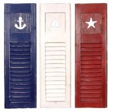 three different colored shutters with an anchor and star on the top one is painted red, white, and blue