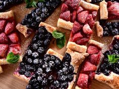 sliced strawberries, blueberries and raspberries arranged on top of each other