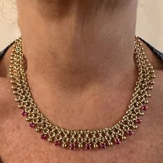 Vintage Tiffany & Co 18k Yellow Gold Ruby Collar Necklace    Metal: 18k Yellow Gold  Length: 16"  Weight: 77.1 grams  Width: 15mm  Stones: 11 round rubies total weight approximately 5ct  Hallmarks: Tiffany & Co 18k Made In Italy T2541rrdd      Please read description for most accurate dimensions and use QA to inquire on any additional details. Yellow Gold Ruby Bead Jewelry, Luxury Ruby Necklace In Yellow Gold, Luxury Yellow Gold Ruby Necklace, Gold Ruby Round Bead Necklaces, Hand Set Round Ruby Necklaces, Gold Necklace With Round Ruby Beads, Gold Ruby Beaded Necklace, Hand Set Round Ruby Necklace, Gold Ruby Necklace With Round Beads