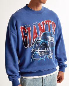 Show your team spirit in style with the Men's New York Giants Graphic Crew Sweatshirt from Abercrombie & Fitch. This piece combines comfort with fan pride, making it a must-have for any Giants supporter.

- Size: Small
- Color: Blue
- Material: SoftAF fleece fabric
- Gender: Male
- Age Group: Adult
- Features: Oversized-fit silhouette, New York Giants graphic on chest, crew neckline, banded hem and cuffs

Perfect for game day or casual wear, this sweatshirt ensures you stay cozy while cheering o Blue Sweats For Streetwear During Sports Season, Relaxed Fit Throwback Sweatshirt With Graphic Print, Blue Fleece Sweatshirt With Graphic Print, Throwback College Sweatshirt With Relaxed Fit, Throwback College Sweatshirt In Relaxed Fit, Blue Sweats For Streetwear In Fall, Blue Graphic Print Sweats For Streetwear, Blue Sweats For Fall Streetwear, Throwback Relaxed Fit College Sweatshirt