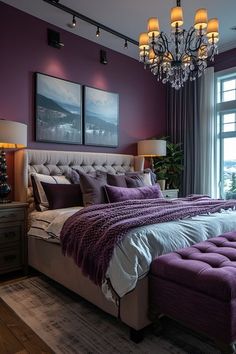 a bedroom with purple walls and a large bed in the middle, along with a chandelier