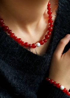 Embark on a journey of auspiciousness with our stunning Natural Red Agate Necklace and Bracelet set – where good fortune meets timeless beauty! 🔴✨Let the red waves of luck and prosperity adorn you in the upcoming New Year! 🧧 Key Features: Material: Authentic red agate beads paired with a lustrous natural pearl for a touch of elegance. Symbolism: Embrace the vibrant energy of the New Year with the auspicious hues of red, symbolizing luck and prosperity. Unique Touch: Each set features natural agate beads, with variations in shades ranging from translucent tomato red to rich cherry red, making each piece truly one-of-a-kind. Versatile Style: Perfect for ushering in the Lunar New Year with warmth and style, enhancing your overall charm. Captivating Hues: Feel the passion of translucent toma Red Waves, Red Agate Necklace, Agate Stone Necklace, Necklace And Bracelet Set, Gemstone Beaded Necklace, Onyx Necklace, Vibrant Energy, Necklace And Bracelet, Red Agate