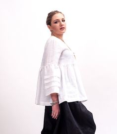 The White linen blouse women is our favorite weekender. This linen clothing featuring an oversized relaxed fit frot button closure and long sleeves. The linen blouse women is made from lightweight linen, that is versatile for any occasion! The White linen blouse women is designed to be comfortable and not troublesome to wear. After wearing this plus size tunic, you will love it even more. The White linen blouse women is made of perfectlinen, high quality pure, soft linen from Italy White linen b Spring Lagenlook Blouse Relaxed Fit, Fall Lagenlook Linen Tops, White Linen Blouse For Fall, Versatile Long Sleeve Summer Tunic, Lagenlook Long Sleeve Linen Blouse, Linen Lagenlook Blouse For Fall, Elegant Linen Tunic For Fall, Oversized Blouse With Unlined Sleeves, Spring Lagenlook Long Sleeve Blouse