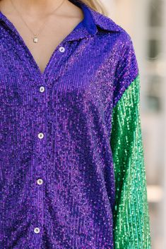 You are going to be so ready to let the good times roll in this sparkly blouse! That Mardi Gras color blocking is so much fun but honestly it's the shiny sequins that caught our attention! Collared neckline Button down front closure Colorblock coloring Sequins Minimal stretch Poppy is wearing the small. Glamorous Purple Sequin Top, Multicolor Sequin Tops For Fall, Color Block Tops For Party Spring, Glamorous Multicolor Tops For Party Season, Glamorous Multicolor Party Tops, Glamorous Multicolor Top For Party Season, Spring Multicolor Sequined Blouse, Multicolor Sequined Tops For Party Season, Festive Multicolor Sequined Blouse