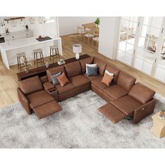 a large sectional couch with multiple pillows on top of it in a living room area