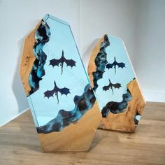 two pieces of wood with bats painted on them