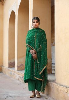 The set consists of georgette a line kurta comes with full length inner, hand work detailing round neck, calf length teamed with cotton palazzo pants and a georgette dupatta to match.The entire set has hand work detailing. Kurta Fabric-Georgette Pant Fabric-Cotton Duptta Fabric-Georgette Color-Green Kurta Length-45 inches Pant Length-37 inches Work-Hand Work Detailing & Bandhej Print Neck-Round Sleeves-Full Sleeves Washing Instructions-Dry Clean Model is 5'6 wearing small size. Floor-length Georgette Palazzo Set For Transitional Seasons, Transitional Floor-length Georgette Palazzo Set, Green Maxi Length Palazzo Set With Dupatta, Transitional Georgette Palazzo Set With Sheer Dupatta, Navratri Georgette Palazzo Set With Dupatta, Diwali Georgette Palazzo Set With Dupatta, Navratri Palazzo Set With Dupatta In Georgette, Diwali Palazzo Set With Dupatta In Georgette, Georgette Palazzo Set With Dupatta For Navratri