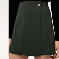 Features Invisible Zipper At Side With Hook-And-Eye Closure Materials & Care Content: 95% Polyester, 5% Spandex Care: Machine Wash Imported Model Wearing Black, The Actual Skirt Is In Red Fall Green Mini Skirt For Work, High-waist Skort For Workwear In Fall, High Waist Skort For Workwear In Fall, Short Skirt With Side Zipper For Work, Green Short Skirt For Fall, Short Green Skirt For Fall, Green Mini Skirt For Workwear, Green Mini Skirt For Office, Chic Green Skort For Fall