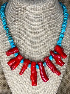 Stunning Genuine  Natural Turquoise chip and Coral Necklace. This glorious statement necklace will coordinate beautifully with your outfits. Whether you're going for casual or dressy look, you will love wearing this comfortable  necklace. It is created using  1 strand of Genuine Turquoise chips, and continues to the center portion of the necklace of large genuine coral sticks.  The necklace is 20.5" long.  The strands finish with large silver tone toggle clasp.  It makes a great gift for your girlfriend or someone else special in your life.  It is a striking necklace and would be a great Valentine gift! This is a red coral and blue turquoise gemstone statement necklace.  It is a bold, colorful,  boho beaded statement necklace for women.    You will never see anyone else with this necklace Red Southwestern Style Jewelry Gift, Southwestern Style Red Jewelry For Gift, Southwestern Style Red Jewelry For Gifts, Southwestern Red Gemstone Jewelry, Southwestern Style Red Gemstone Jewelry, Handmade Southwestern Red Jewelry, Southwestern Red Jewelry With Natural Stones, Unique Handmade Coral Jewelry, Handmade Coral Jewelry