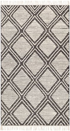 an area rug with squares and fringes on the bottom, in grey and white