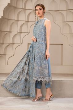 Elegant Blue Short Shirt with Capri Pakistani Party Wear Curated in a wonderful blue tone, blue bell embraces a perfection in its subtle embroidery and sequins work. Paired with a floral design dupatta and a tonal trouser this ensemble is a step towards slaying this season. A stellar piece curated on a navy blue lawn base painstakingly worked in shades of gray & ash white thread is topped with silver spangles & zari creating a floral pattern for the front. Detailed Description: SKU: PB0033 Detai Pakistani Boutique, Pakistani Party Wear, Chiffon Sleeves, Eid Dresses, Embroidered Sleeves, Embroidered Chiffon, Luxury Wear, Blue Bell, Chiffon Dupatta