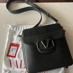 Valentino Loc Crossbody Calfskin Bag Drop Length: 55 Cm / 19.6 In. W23xh25xd6 Cm / W9x9.8xd2.3 In. Brand New In Box Includes Dust Bag, Tag Designer Everyday Luxury Crossbody Shoulder Bag, High-end Top Handle Bag With Logo, Designer Shoulder Bag With Logo, Designer Logo Shoulder Bag, Leather Evening Bag With Logo, Evening Leather Bag With Logo, Evening Leather Bags With Logo, Elegant Leather Bags With Logo, Modern Evening Bags With Logo