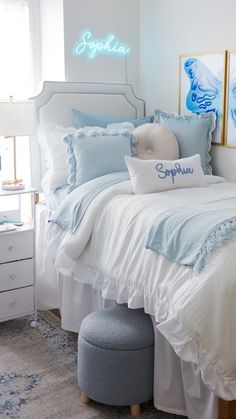 a bed with blue and white comforters in a bedroom