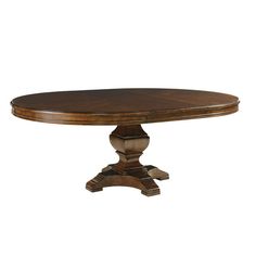 an oval wooden table with two pedestals