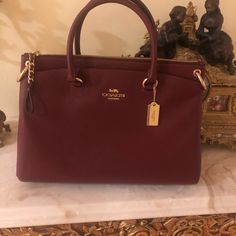 Beautiful Brand New Coach Satchel With Long Adjustable Strap For Shoulder Wear. Red Burgundy Color With Gold Hardware. It Has 3 Compartments. Measurements Approximately 13 1/2 By 9 Inches Burgundy Coach Bag, Burgundy Satchel With Zipper And Double Handle, Burgundy Double Handle Satchel With Zipper, Burgundy Office Bag With Gold-tone Hardware, Burgundy Office Bags With Gold-tone Hardware, Daily Use Burgundy Satchel With Gold-tone Hardware, Elegant Burgundy Double Handle Satchel, Burgundy Satchel With Gold-tone Hardware, Chic Burgundy Satchel With Gold-tone Hardware