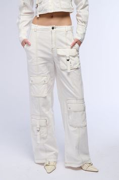 Nailing the trends in The AKIRA Label Aced It Wide Leg Cargo Pant. These slightly stretchy cotton bottoms feature a high rise waist, functional belt loops, contrast stitching, faux hematite metallic hardware, waist-cinching buckled straps at the sides, and a wide leg silhouette. Complete with side slant front pockets, one back zippered pocket and one snap button flap back pocket, two buckled strap cargo pockets on the front as well as two snap button flap pockets, and a front zip button closure. For a finished look, style with the coordinating AKIRA Label Aced It Long Sleeve Cargo Button Down.  - Shell: 100% Cotton - Some Stretch - Imported  (all measurements are approximate from size small) - 12” Rise - 31” Inseam - Model is 5’9” Product ID: 391934  (all measurements are approximate from Cotton Bottoms, Cargo Pant, Cinched Waist, Flap Pocket, Snap Button, Wide Leg, High Rise, Size Small, Zipper